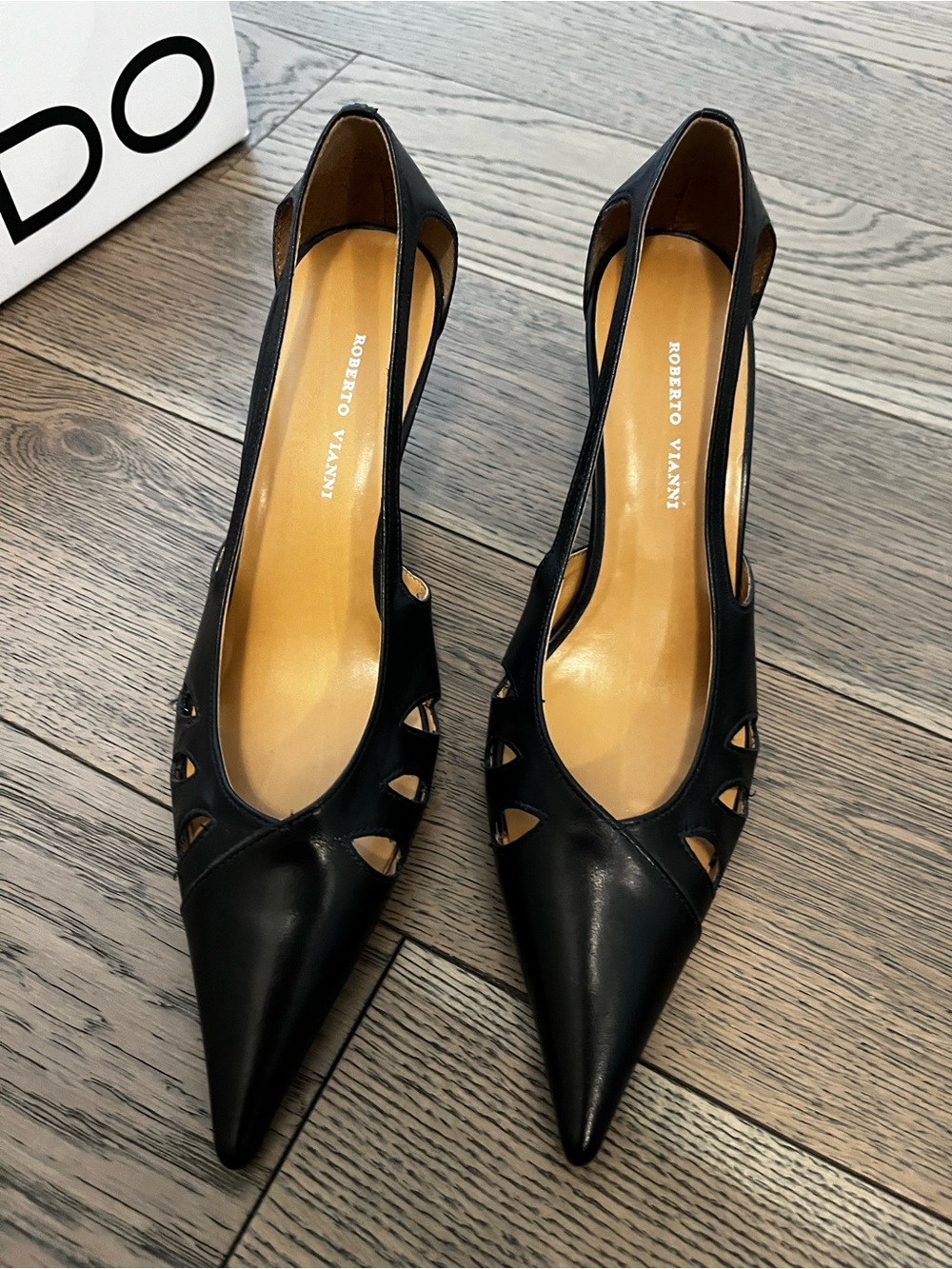 Black Pointed Toe Cutout Pumps by Roberto Vianni